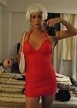 Nikki Montero in a motel trying out various outfits and toying her ass with a water bottle